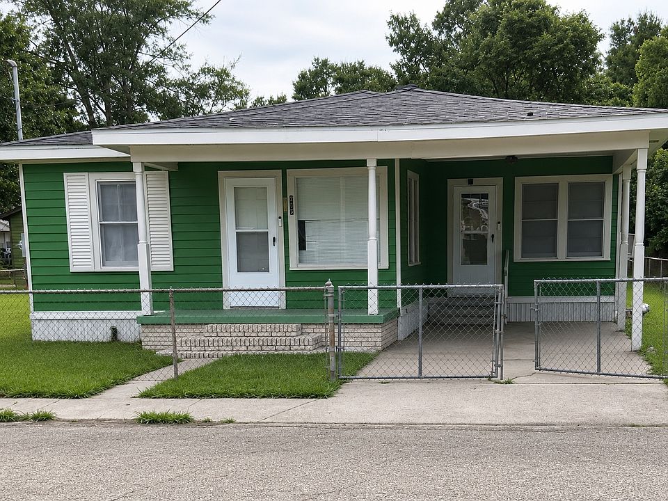3-bedroom, 1-bath home with covered front porch, carport, and a spacious fenced yard.