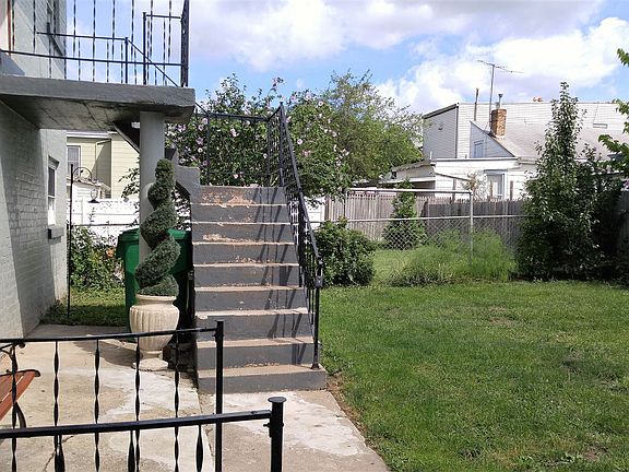 Nice backyard for grilling or relaxing.