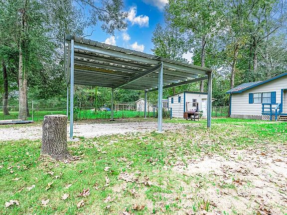 2 car port provides shelter to equipment or vehicles.