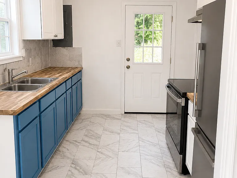 New cabinets, butcher block stained countertops. Stackable washer/dryer hookup to the left of the sink.

Photo Note: Photos have been lightly enhanced to improve lighting and image quality. Colors, finishes, and exterior conditions may vary slightly.
