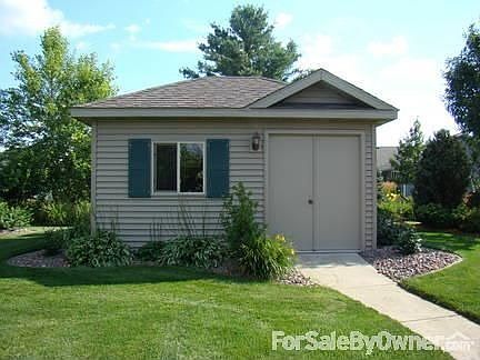 Garden shed : 20 x16 Double door entry. Two windows. Wooden storage shelving built in
