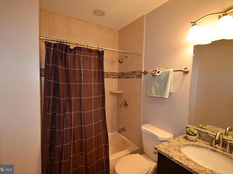 Second Full bathroom / Upper level with a tub