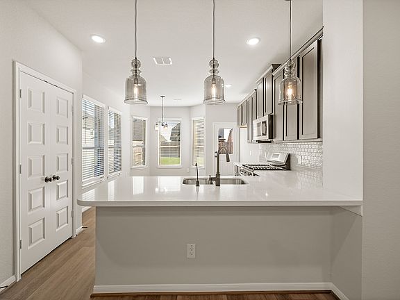 Kitchen with peninsula and pendant lighting