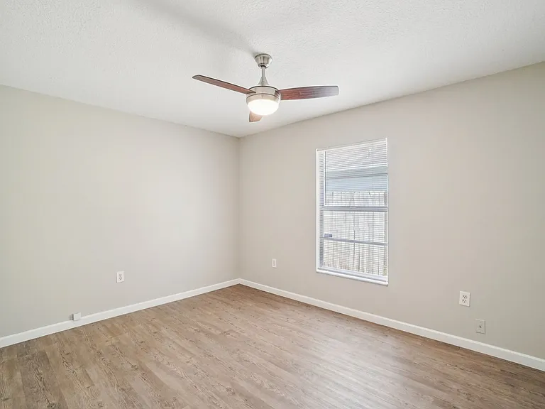 Bright and airy with modern flooring and views of the quiet surroundings.