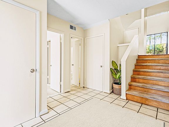 Natural light enhances the bright, welcoming entryway.