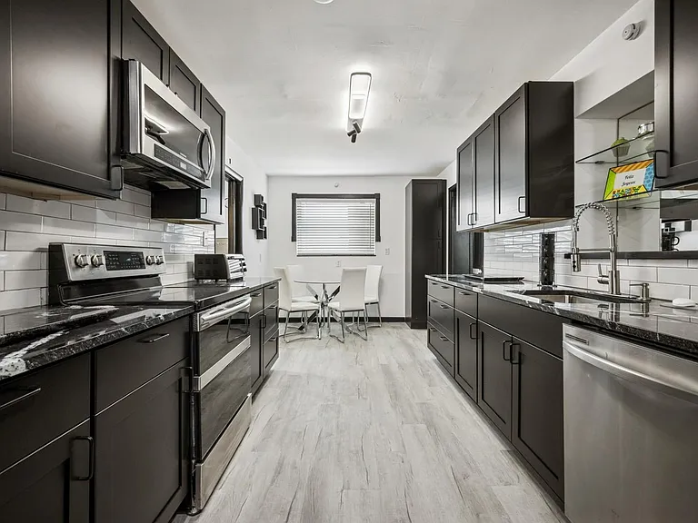 New kitchen Gourmet 
with Stainless steel appliances, New Contemporary kitchen cabinets, New Granite counter tops