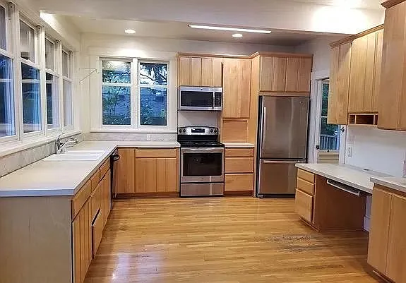 Very large new kitchen with French doors opening on to expansive deck and back lawn and gardens