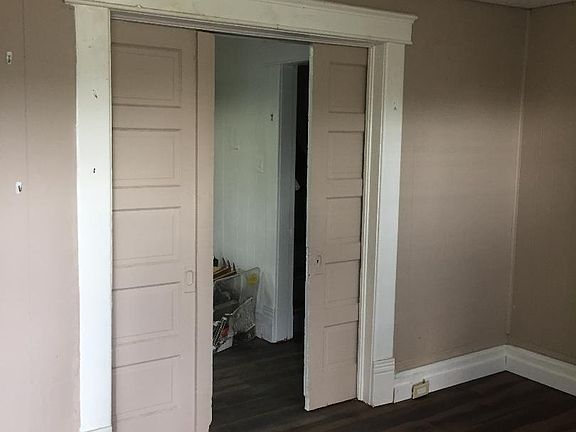Family room, new faux wood floors, pocket doors