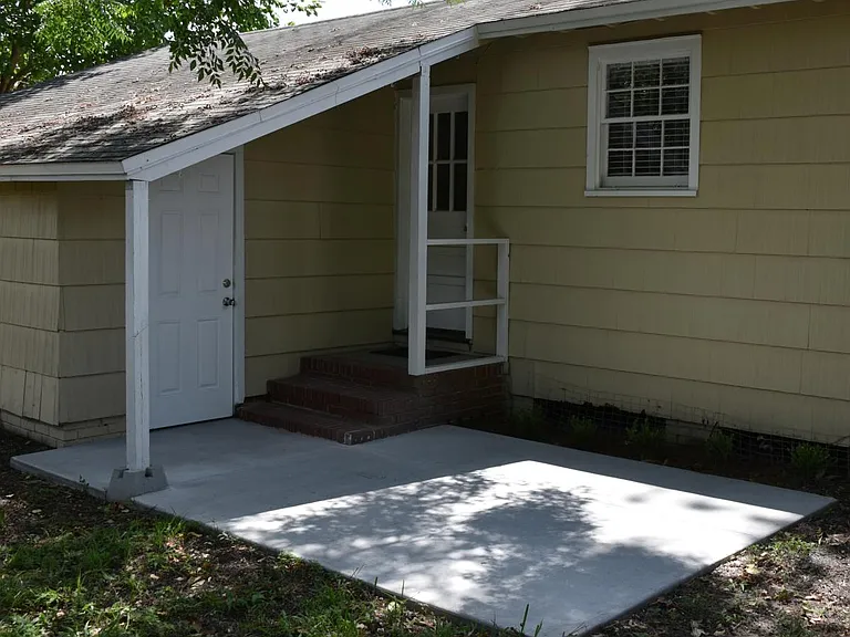 Back yard: Patio, fully fenced, covered garage access