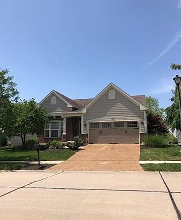Notice the Craftsman detail of the upgraded exterior elevation with brick accents.