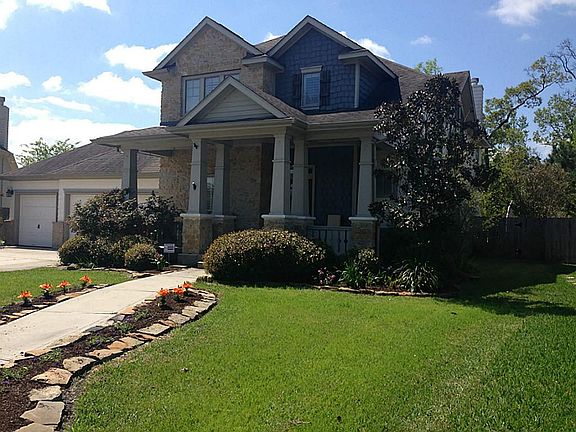 3 car garage, front porch, and beautiful stone! double wide driveway is a plus!