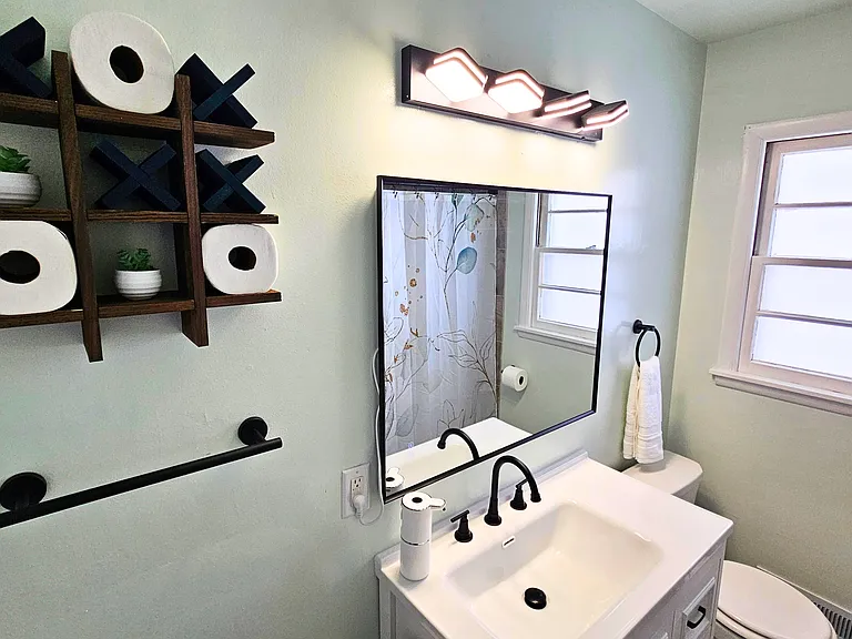 Main floor bathroom also includes a bathtub/shower