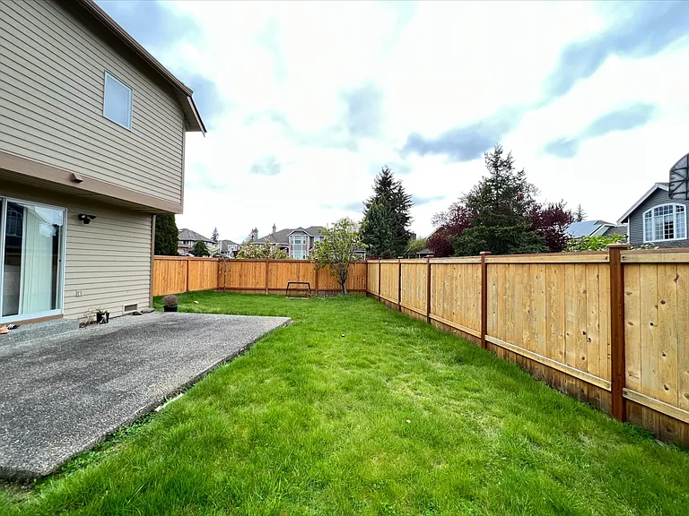 flat fence back yard with patio
