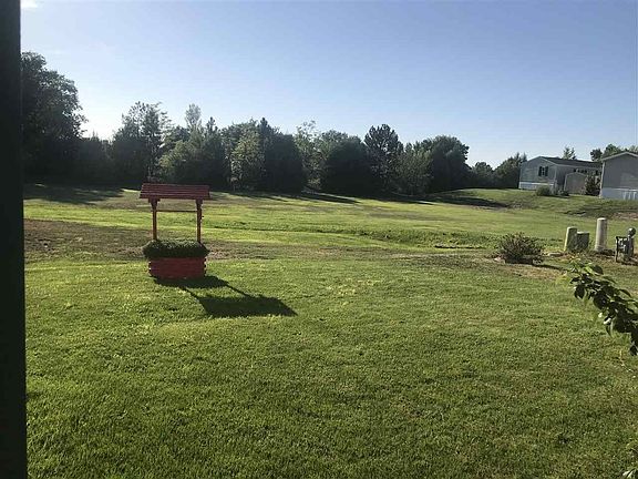 Backyard is connected to a small park or play area