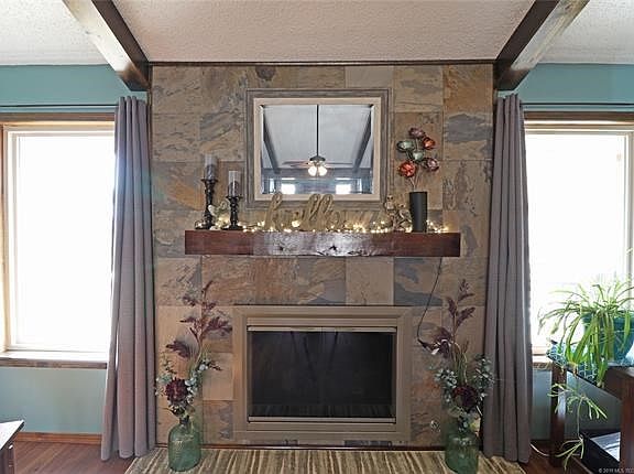 Living Room Fireplace:  WOW!  Hearth removed and Gas burning Fireplace surface replaced to reveal beautiful  focal point of this expansive living room.  Can be reverted to Wood burning.