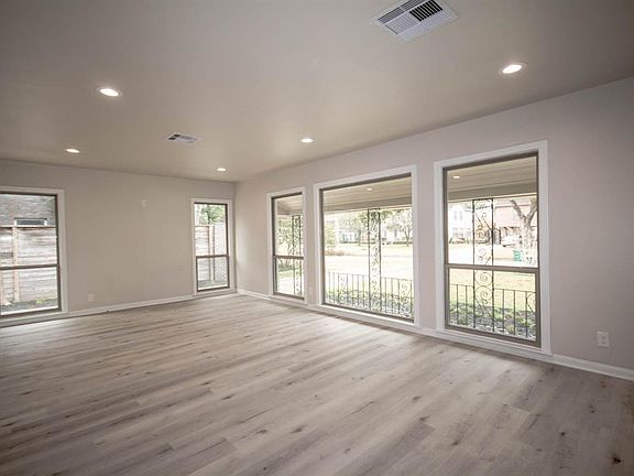 Huge living room bringing the outside in with recess lighting