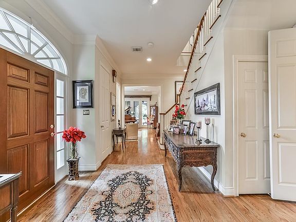 Beautiful entry with hardwood floors and high ceilings.