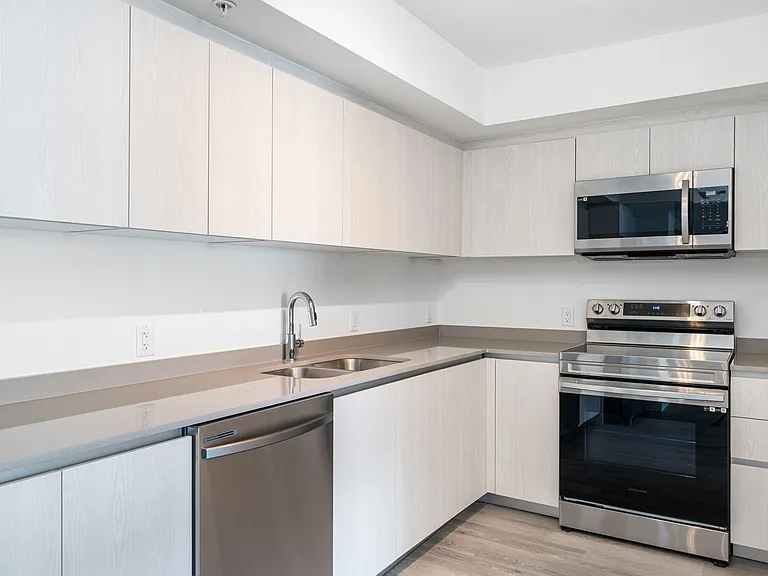 Your new home features spacious kitchens with brand-new stainless steel appliances.