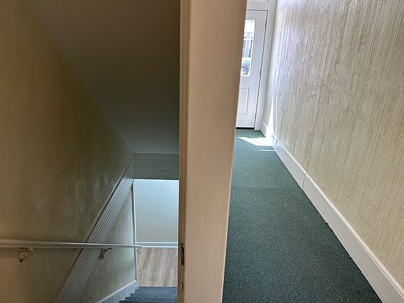 Hallway showing stair entry to apartment on lower level.