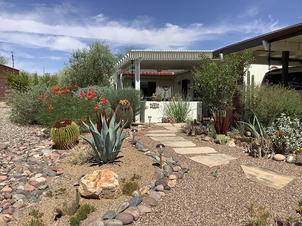 Entrance through the garden with view of private front porch.
