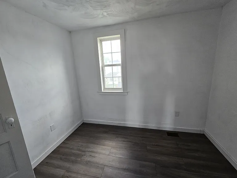 Additional room leading to third story bedroom could be used as an office.