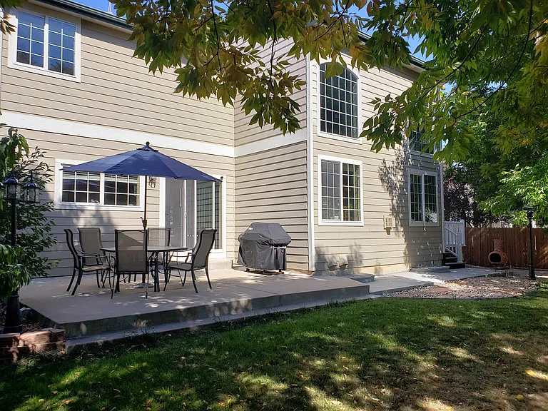 Patio and fenced back yard.