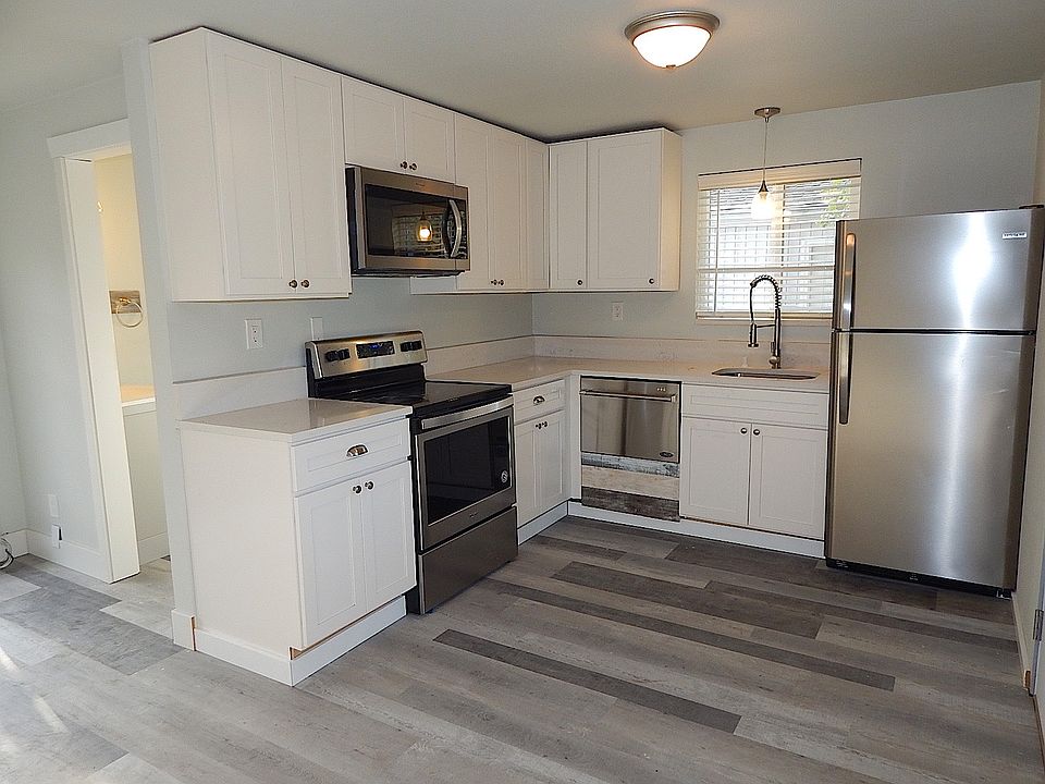 Full kitchen with quartz counters and stainless steel appliances