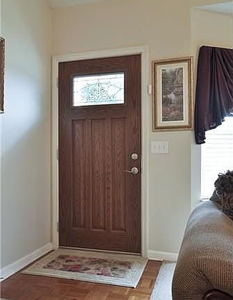 Nice front door with new storm door. 