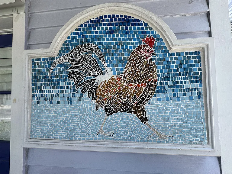 Key West Rooster tile creation meets your entry into this upgraded home.