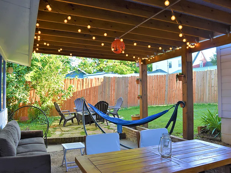 Roofed back patio is fantastic for enjoying the mountain weather