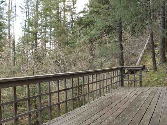 Tucked into the trees on nearly an acre, this cabin offers so much privacy! Front deck is great for 