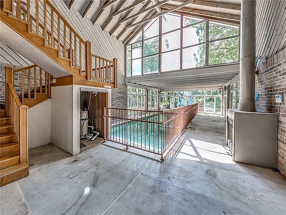 The pool is also fenced for child protection.  Cozy up to the gas fireplace during the cooler months. The stairs lead to the private 3rd bedroom.