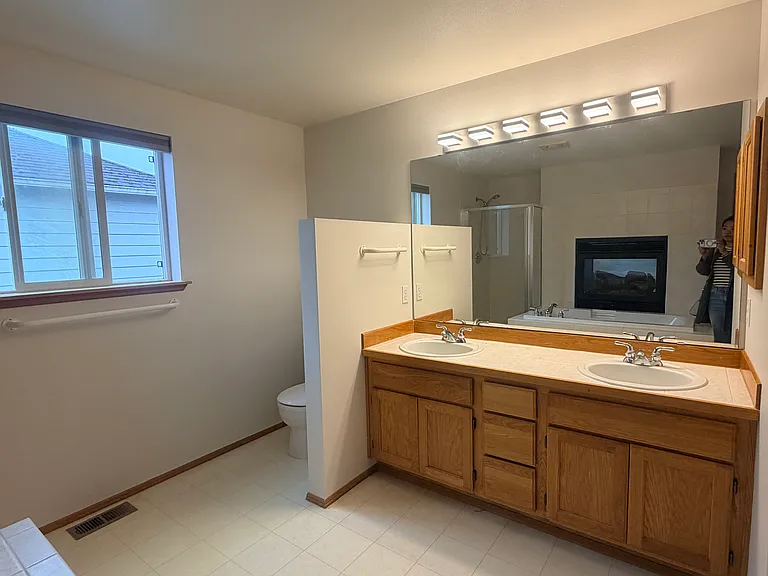 Primary bathroom with a see through fireplace into the primary bedroom!