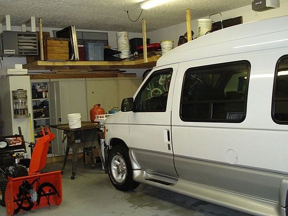 Outbuilding has 10' garage door with opener