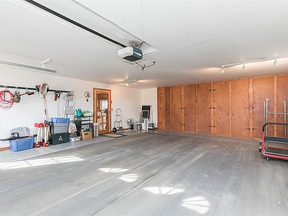 Zero entry to the home from the garage. Tons of built in storage lines the front of the garage space.