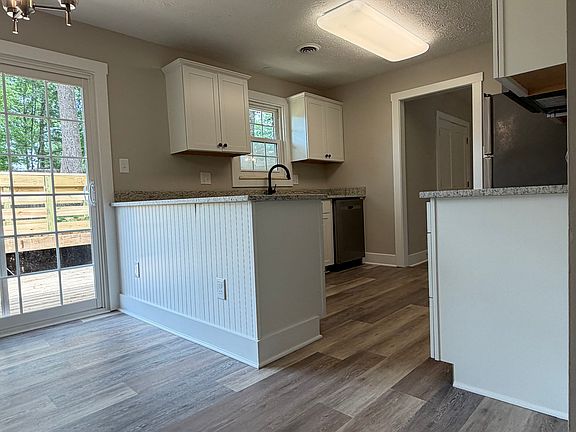 Updated kitchen with new cabinets and granite counters