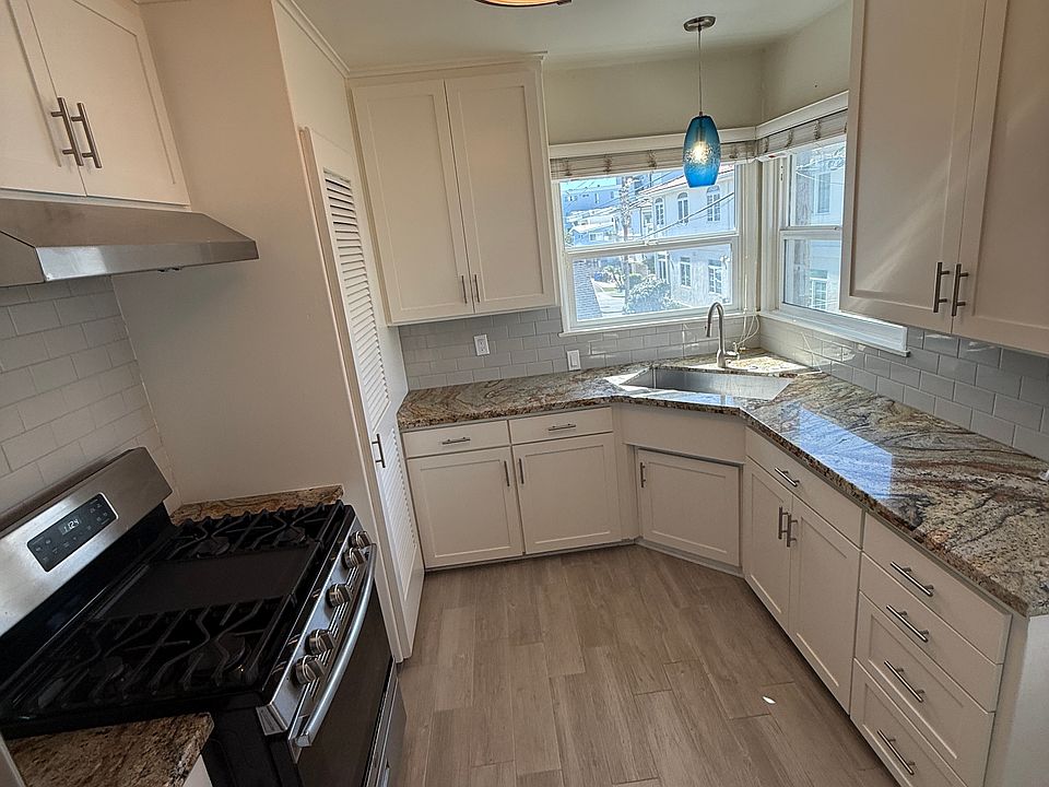 Updated Kitchen with granite counter, stainless appliances and storage