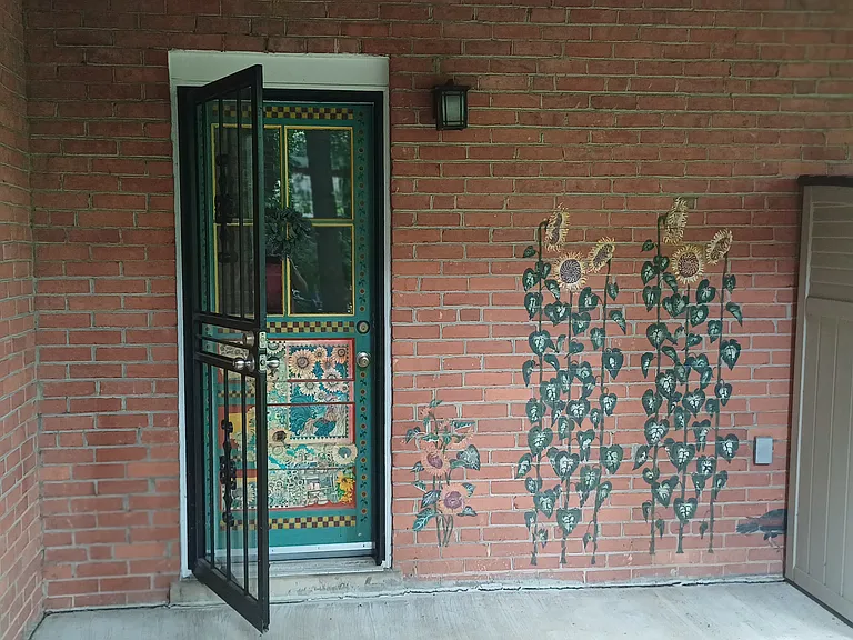 Separate basement entrance accessing backyard.