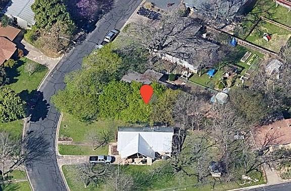 Large lot with many trees and a large garden area