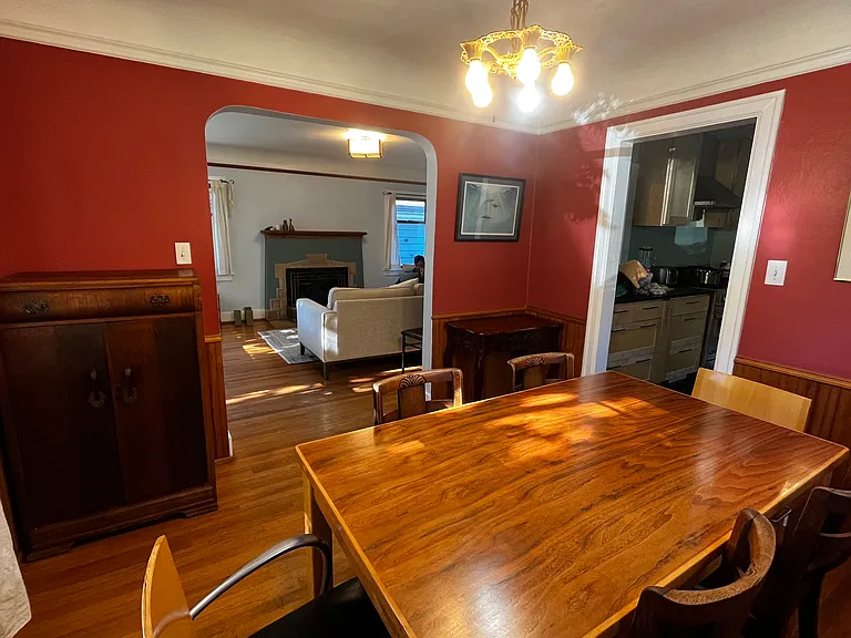 Dining room also has coved ceilings and picture rail moulding