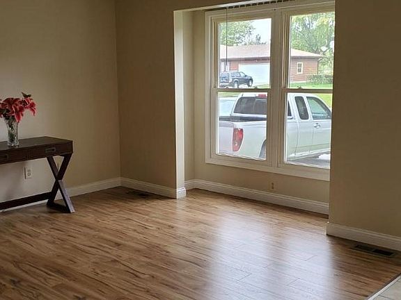 Spacious Living Room with picture window and new laminate flooring