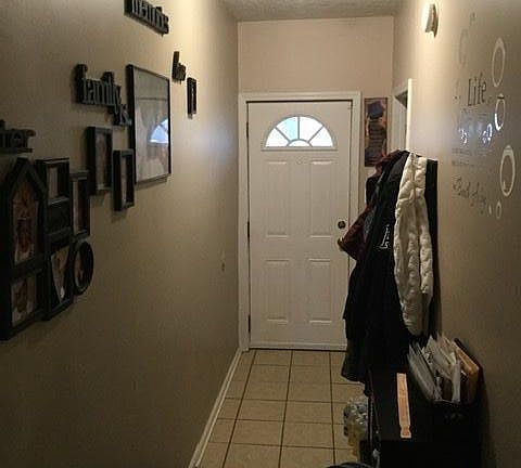 Hallway from front room to front door.