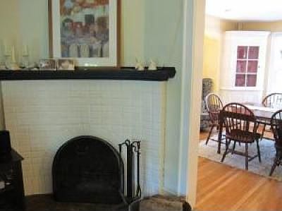 LR/ Curved, brick fireplace