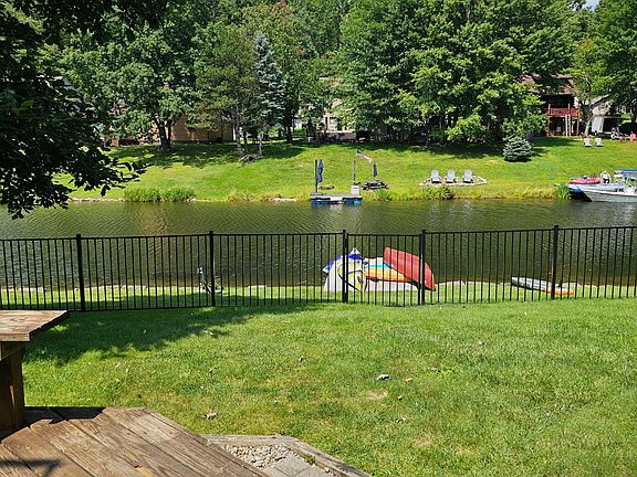 View from the lower level deck. Fenced backyard and Dock. Boat, Jet ski, kayak, or swim right from the backyard!
