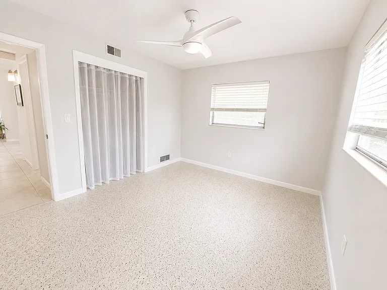 Bedroom #3 with one cedar closet. Terazzo floors.