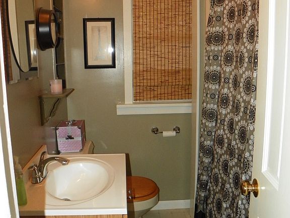updated main floor bathroom, small but extra functional with in- wall storage