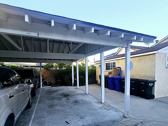 Covered carport will fit 2 cars