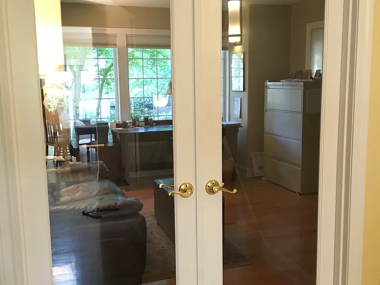 Glass doors enclose the office space, hardwired Xfinity internet.