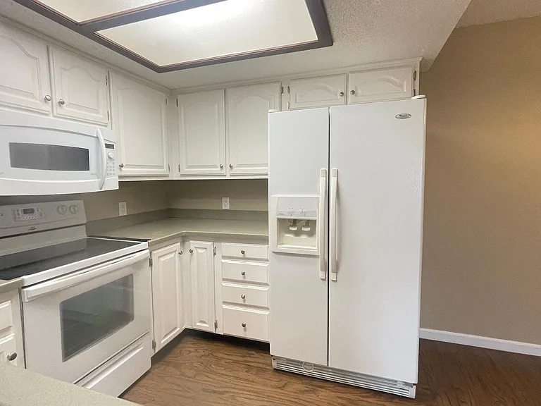 View of Full Kitchen thru Open Half Wall