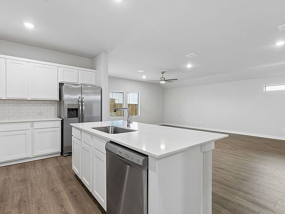 Kitchen in the Oscar home plan by Trophy Signature Homes - REPRESENTATIVE PHOTO
